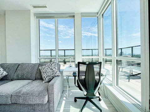 Relax inside or step out—this living room offers both