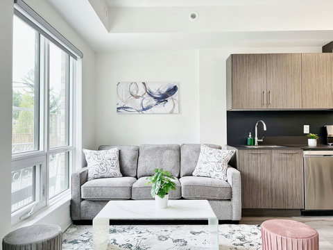 Relax on our modern sofa while taking in the serene outdoor scenery.