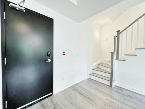 lean and well-lit staircase providing easy access between levels.”