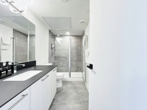Clean and modern bathroom designed for a comfortable stay