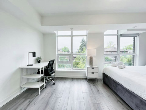 Bright workspace with a comfortable desk setup and calming outdoor view.