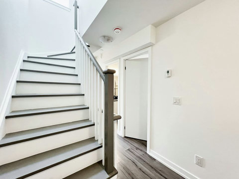 Modern, sturdy staircase connecting the home’s main spaces