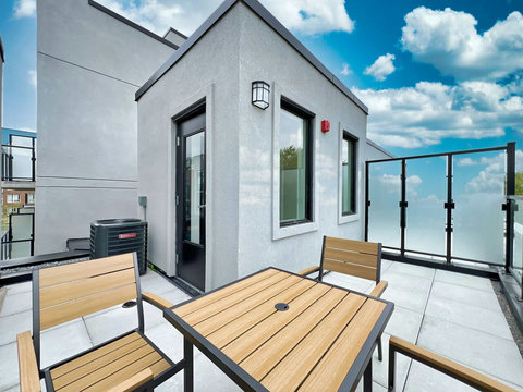 Beautiful rooftop space with a cozy patio and stunning views all around