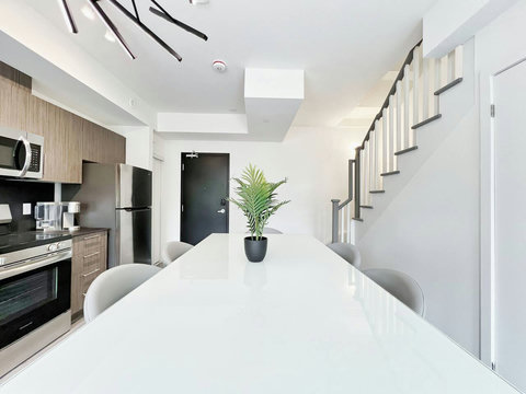 Simple and modern dining area ideal for family or group meals.