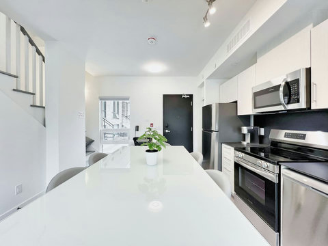 Fully equipped kitchen and bright dining area — perfect for cooking and gathering.