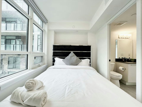 Bright and comfortable bedroom designed for a restful sta