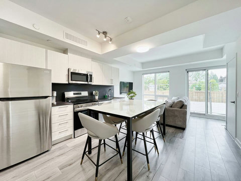 Fully equipped kitchen and bright dining area — perfect for cooking and gathering
