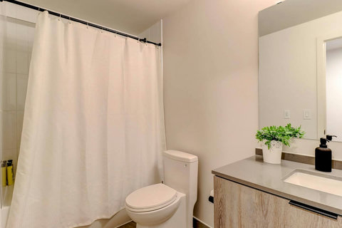 Stylish, well-lit bathroom with contemporary design.