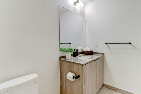 Stylish, well-lit bathroom with contemporary design.