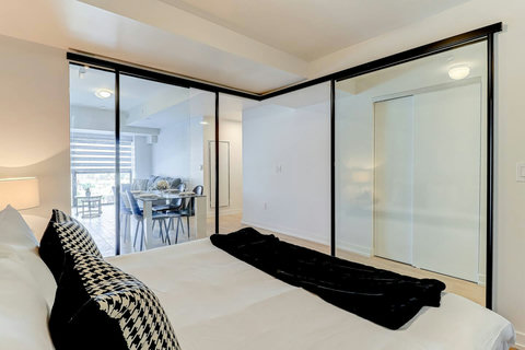 Modern bedroom retreat with AC, cozy linens, and a restful vibe