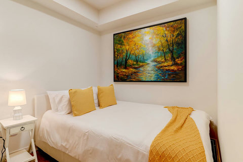 Bright and cozy bedroom designed for comfort and a peaceful night’s rest.