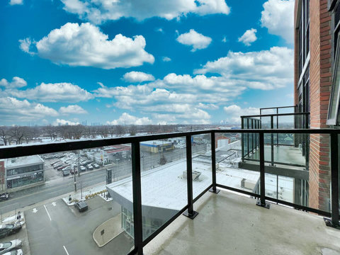 Cozy private balcony for enjoying the fresh air and city views.