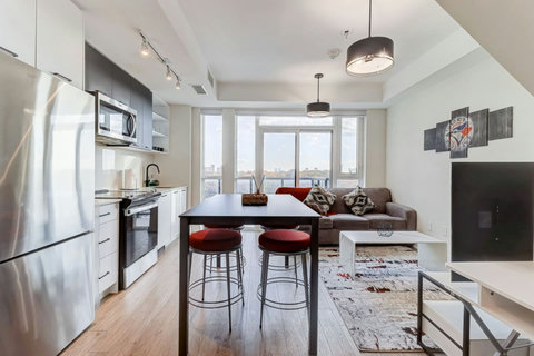 Bright dining area with a modern table setting, cozy lighting, and space for family meals or friendly gatherings—ideal for sharing moments over coffee or dinner.