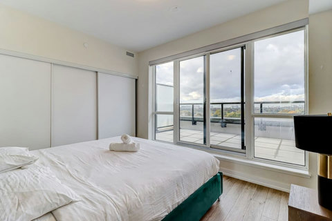 Elegant bedroom with a premium king bed, warm lighting, and modern finishes—designed for ultimate comfort and relaxation.