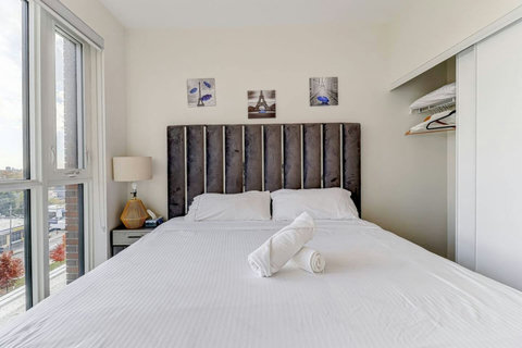 Inviting bedroom with a king-size bed and soothing tones, ideal for couples or families seeking a restful retreat.