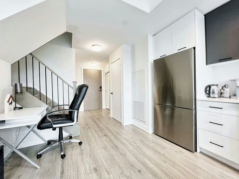 Bright and focused workspace with a comfortable desk and chair — perfect for remote work, study, or creative projects during your stay.