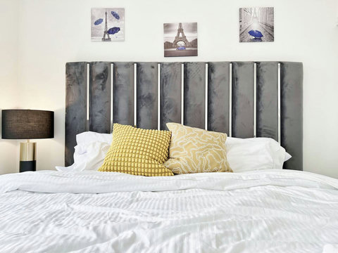 Inviting bedroom with a king-size bed and soothing tones, ideal for couples or families seeking a restful retreat.