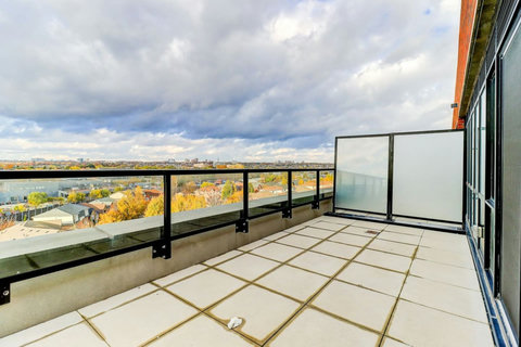 Cozy private balcony for enjoying the fresh air and city views.