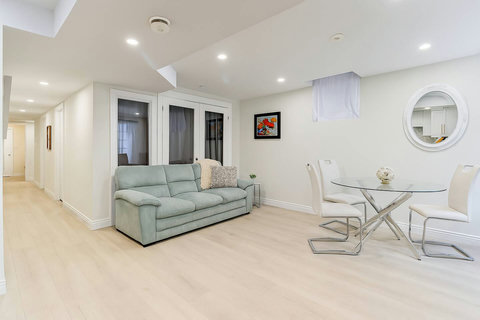 Simple yet sophisticated — a living room styled for comfort with cozy seating and a central round table