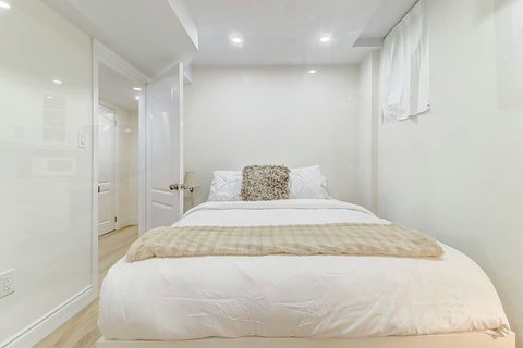 Modern minimalism at its finest — a bedroom designed for relaxation.