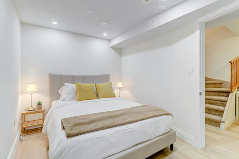 Simplicity meets elegance in this bright bedroom with a cozy queen-size bed
