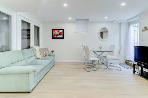 Comfort and connection meet in this inviting living space with a modern round table and elegant seating