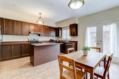 Cook, gather, and connect in this fully stocked open kitchen and dining space.