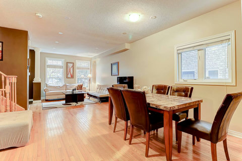 Dine in style with an open view of the modern living room, where every meal feels like a moment to share