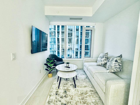 Cozy living room with comfortable seating and a smart TV for relaxing downtime.