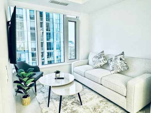 Cozy living room with comfortable seating and a smart TV for relaxing downtime.