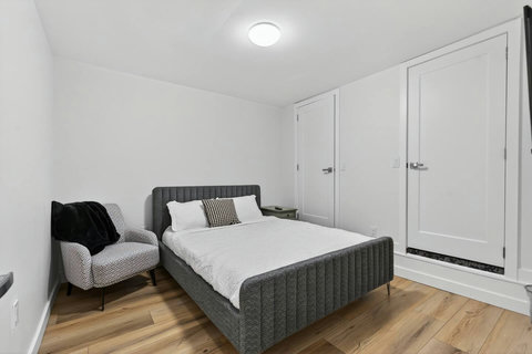 Relax in this well-appointed queen ensuite bedroom with plenty of natural light.