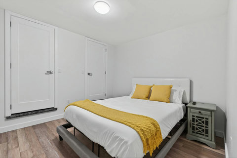 Well-kept queen bedroom with attached ensuite designed for guest convenience.