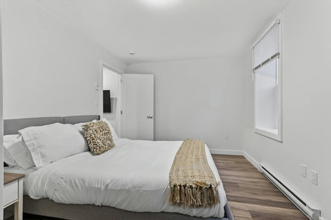 Modern queen-bedroom ensuite offering privacy and comfort in one space