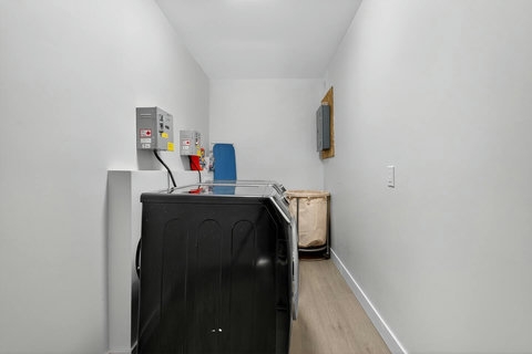 Well-organized closet offering convenient hanging and shelf space.