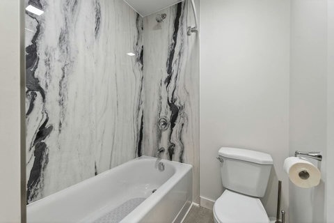 Clean and modern bathroom featuring a comfortable bathtub for relaxation