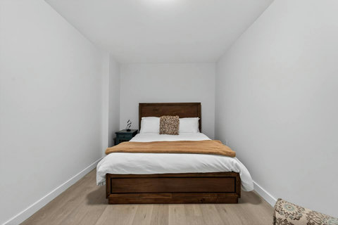 Relax in this well-appointed queen ensuite bedroom with plenty of natural light.