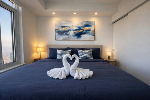 Inviting bedroom with soft bedding and a relaxing atmosphere.”