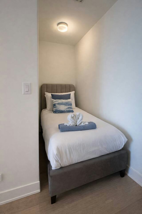 Cozy bed set up in the den area for extra sleeping space.