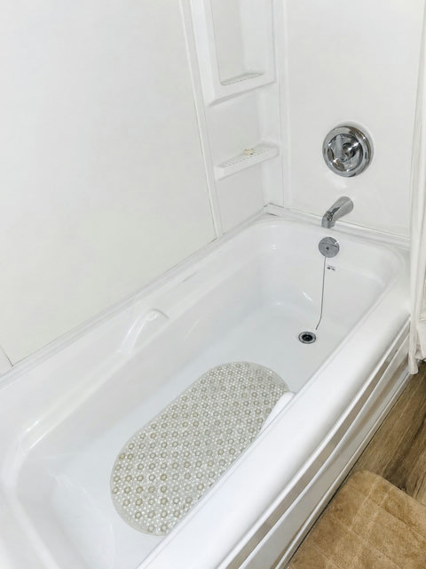 Unwind with a relaxing soak in this clean and comfortable bathtub.