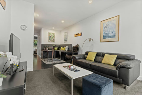 The apartment has a great open-plan floor space with the living room, dining space and kitchen.