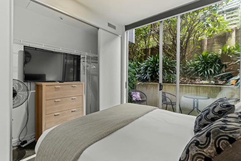 You can lie in bed and watch TV on the 43" TV or connect to  your own streaming service.