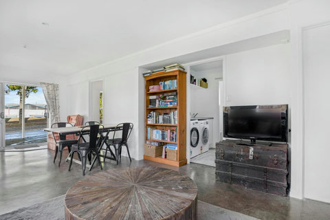 The bathroom and laundry is located off the main living spaces.