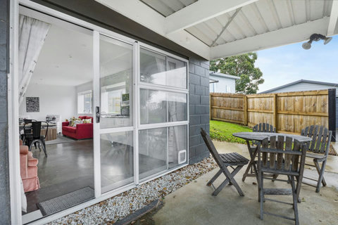 Sit outside under the covered patio area in any weather.