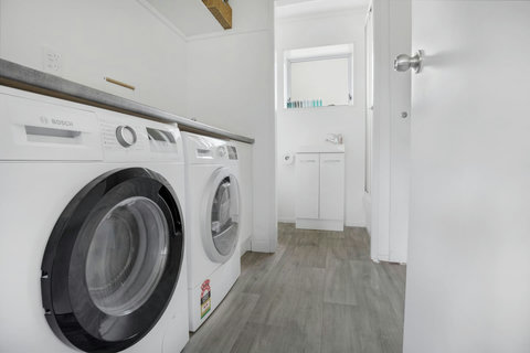 The washing up sink for dishes, etc is located in the laundry area.