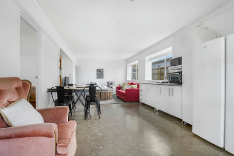 The kitchenette has a fridge, freezer, microwave, portable cooktop and a benchtop cooker.