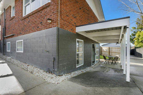 The entry and covered patio show the entrance to the unit.