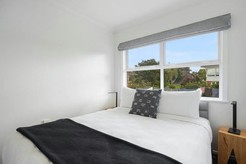 Each bedroom has a headboard, bedside tables and lamps.