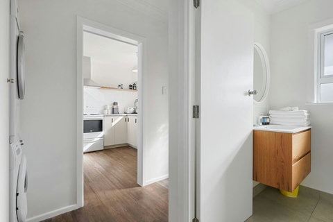 The laundry is separate from the bathroom and adjoin the back door.