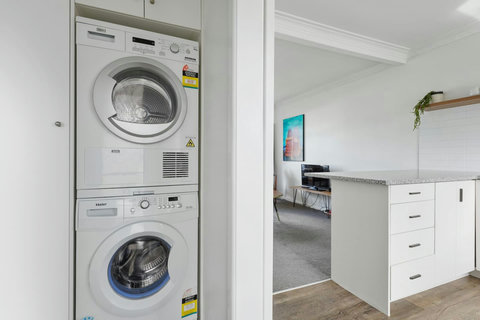 The washing machine and dryer are new, front loading and energy efficient. It is in an alcove hallway between the kitchen and bathroom. We provide complimentary washing powder for you to use during your stay.