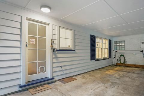 Entry is through the carport.